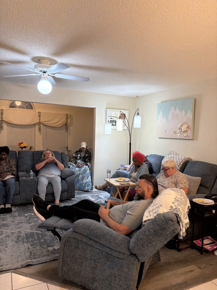 The Harvest House family gathered together in the living room